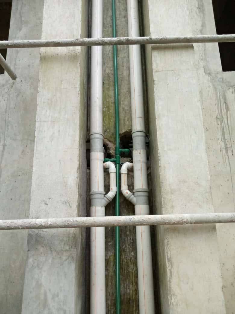 External pipe routing between walls