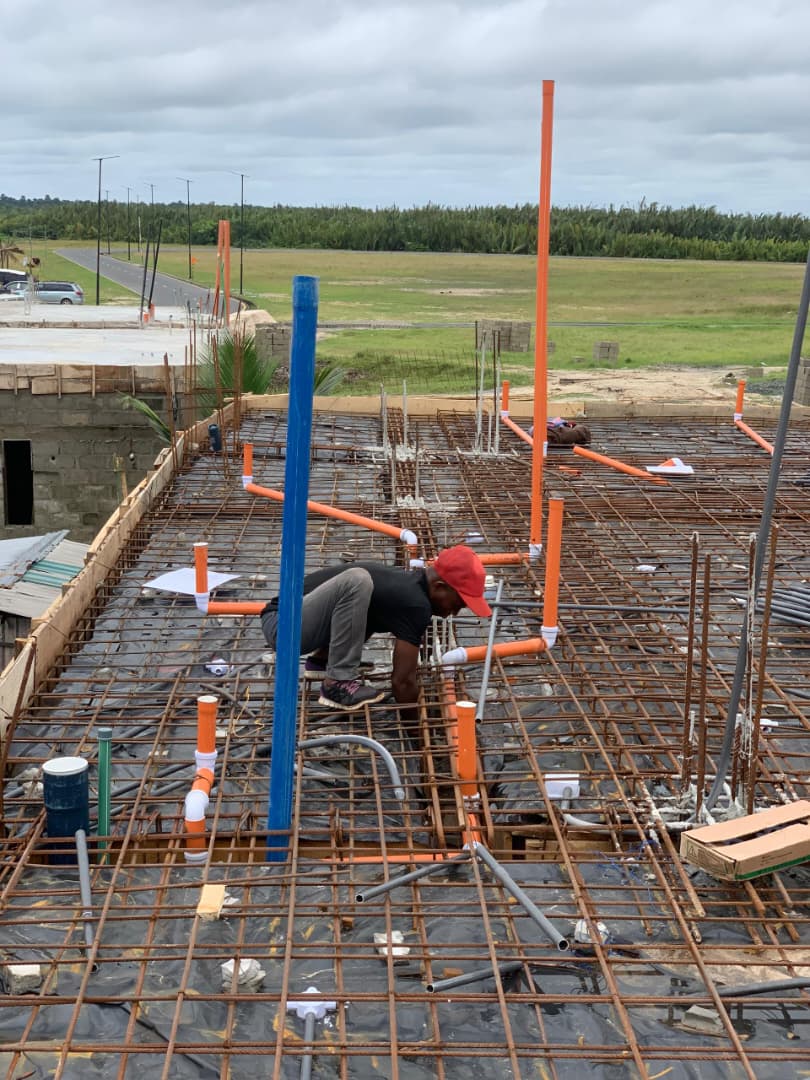 Engineers working on rooftop water tank